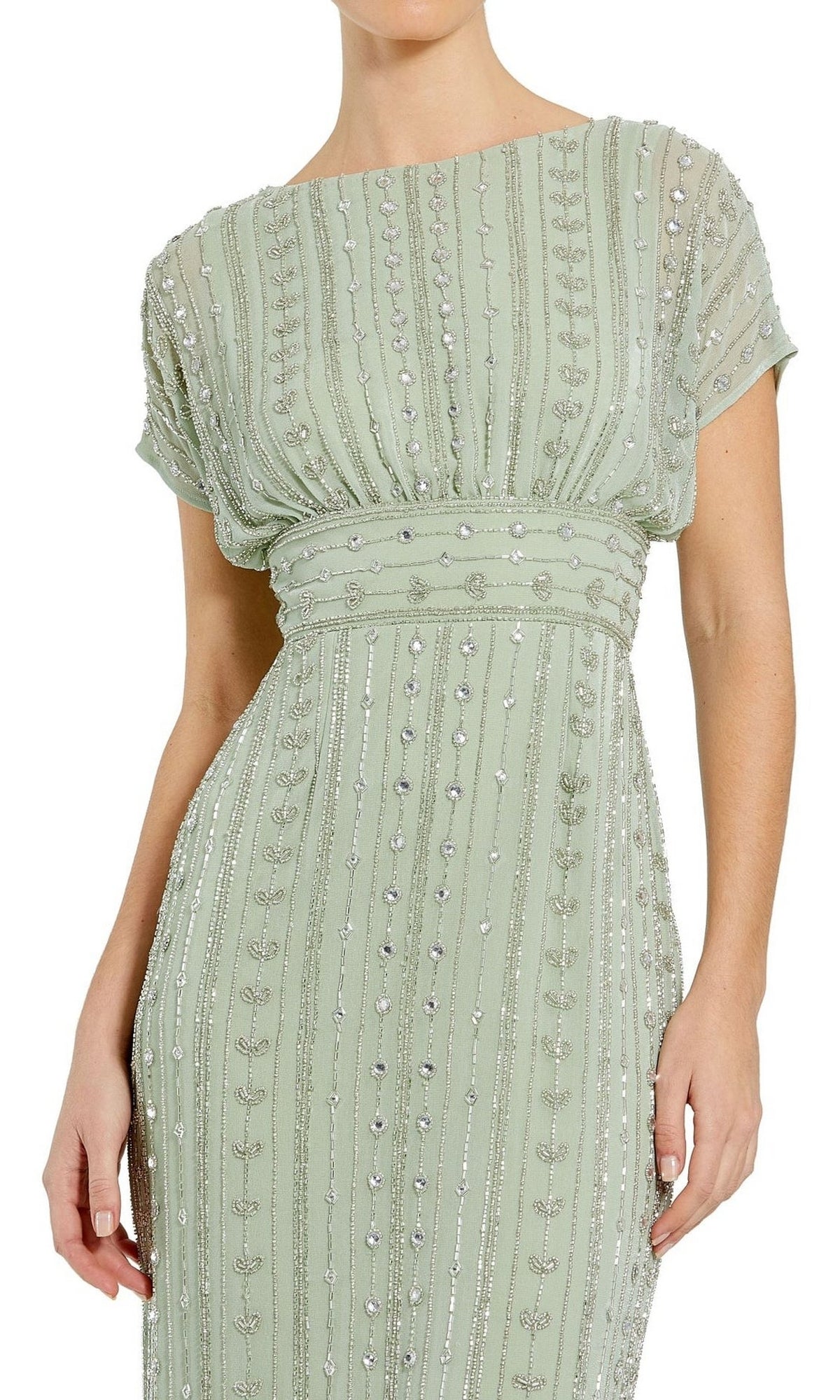 A woman wears the Mac Duggal Beaded Short Wedding-Guest Dress 93649, a light green, short-sleeved gown with silver vertical beading and a gathered waist detail.